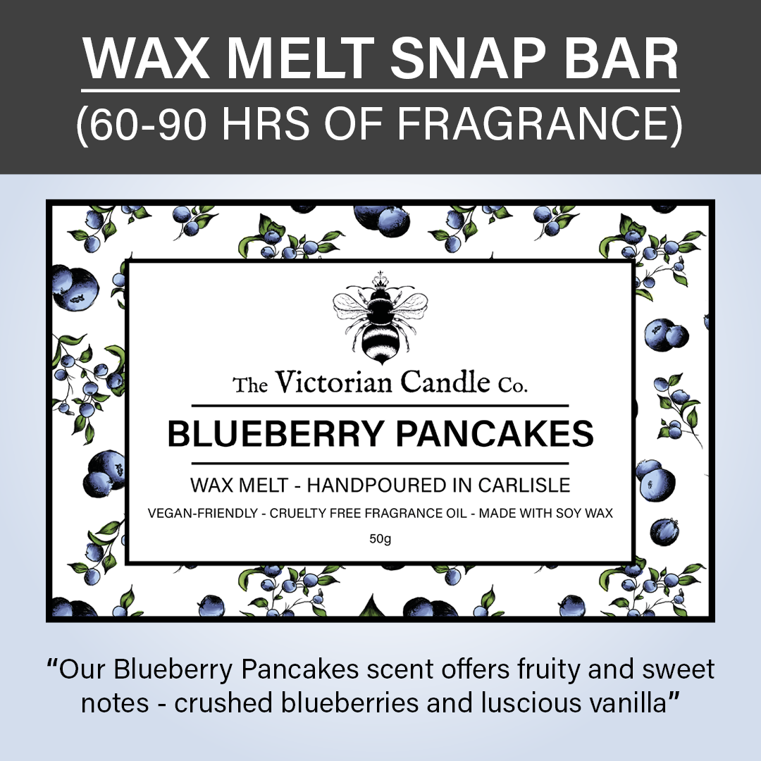 Label for The Victorian Candle Co.'s Blueberry Pancakes Wax Melt Snap Bar, surrounded by blueberries and leaves. The label highlights its delightful scent, emphasizing that it is vegan-friendly and cruelty-free. Made with soy wax in biodegradable packaging, the product provides 60-90 hours of fragrance enjoyment.