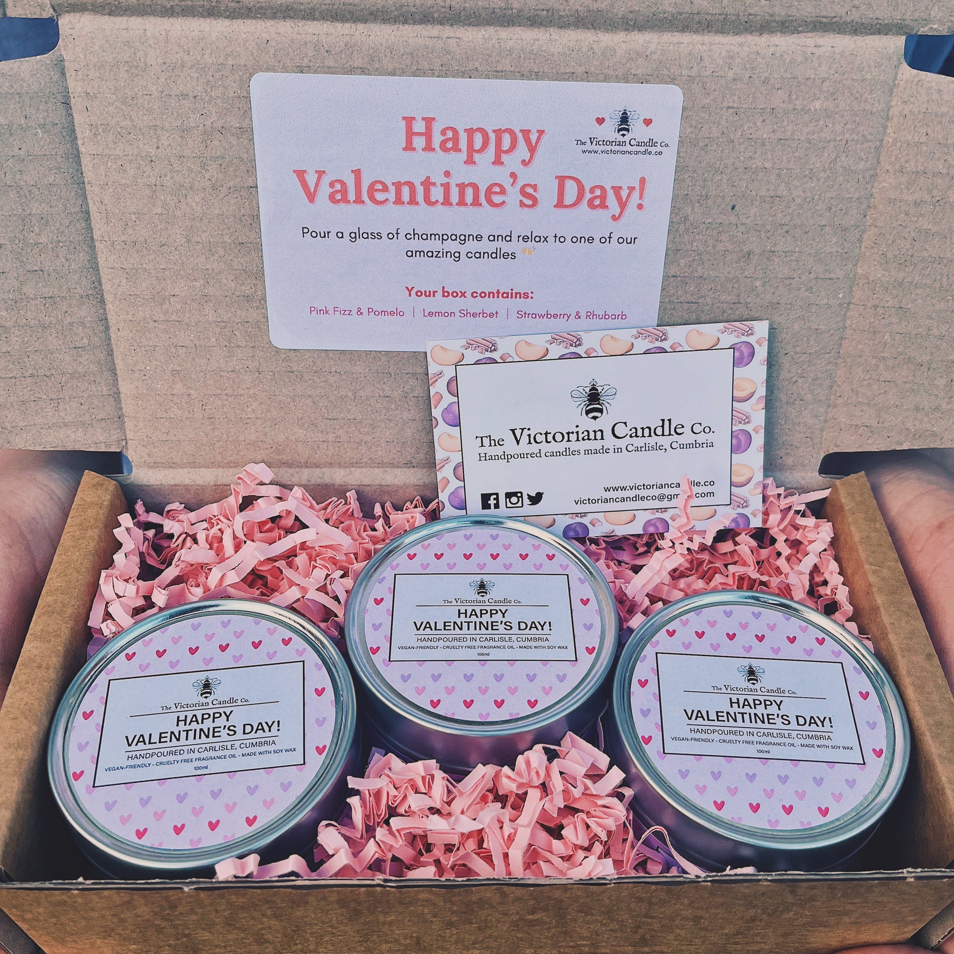 The Limited Edition Valentines Day Trio Gift Box 💕 from The Victorian Candle Co. includes three scented candles in Pink Fizz & Parma, Lemon Sherbet, and Strawberry & Rhubarb nestled in pink crinkle paper, with Happy Valentines Day!” on the lid and a business card included.