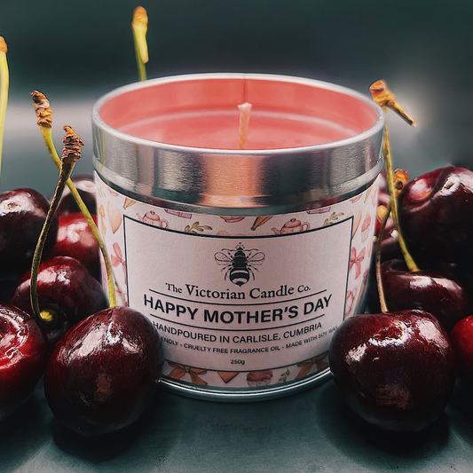 The Victorian Candle Co.s large 200ml round metal tin features their limited edition Black Cherry Mothers Day candle nestled among fresh cherries. This pink soy wax candle reads Handpoured in Carlisle, Cumbria, making it a perfect exclusive Mothers Day gift.