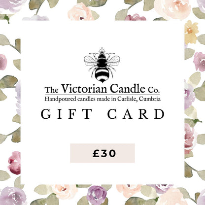 The Victorian Candle Co. Gift Card showcases a bee and floral watercolor design with the text "Handpoured candles made in Carlisle, Cumbria." Valued at £30, these digital gift cards let you select from a wide range of scents, with no expiration date.