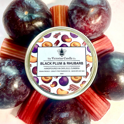 The Black Plum & Rhubarb - Scented Candle by The Victorian Candle Co. is a standout piece, surrounded by the rich essence of deep purple plums and lively red rhubarb. Crafted from soy-based, vegan-friendly wax, this 100ml tin candle offers a cruelty-free fruity fragrance that captivates the senses.